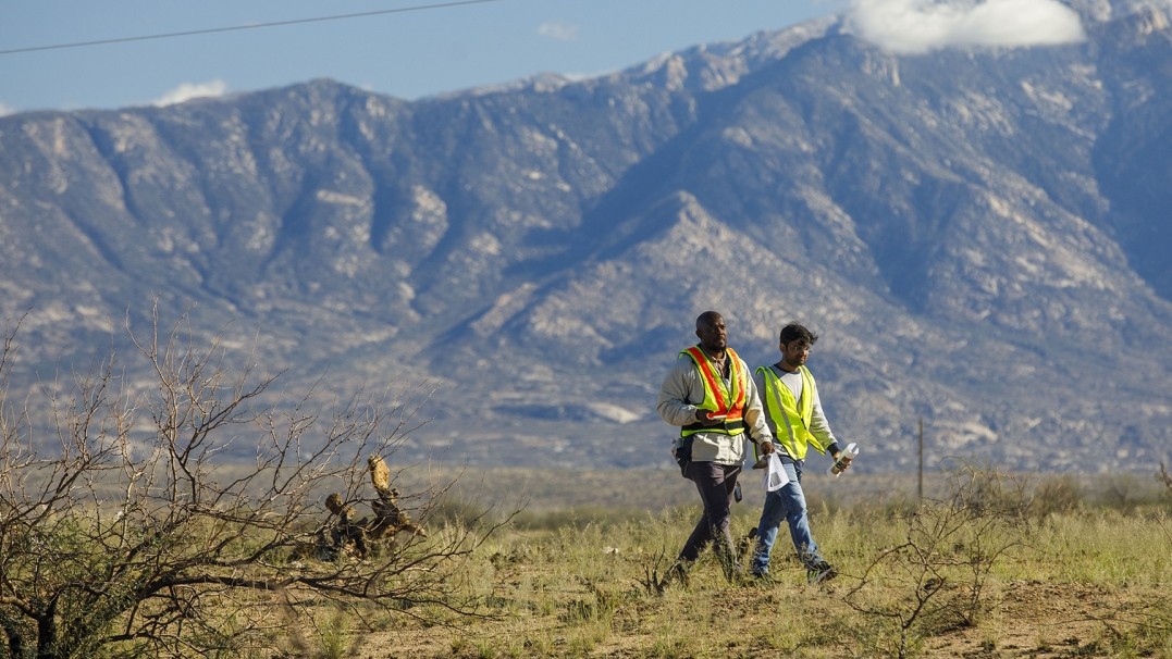 Arizona State University graduate student Adesola Adegoke and visiting researcher Manoj Kumar walk through the Saddlebrooke Fire burn site near Mount Lemmon in November 2025. 