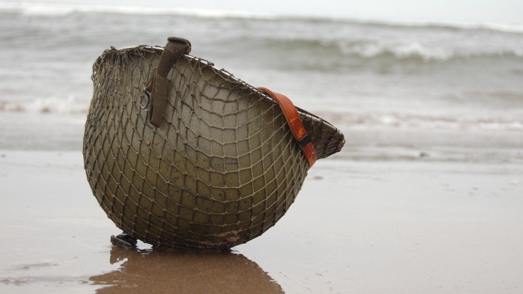 A soldier's helmet washed up on a beach 