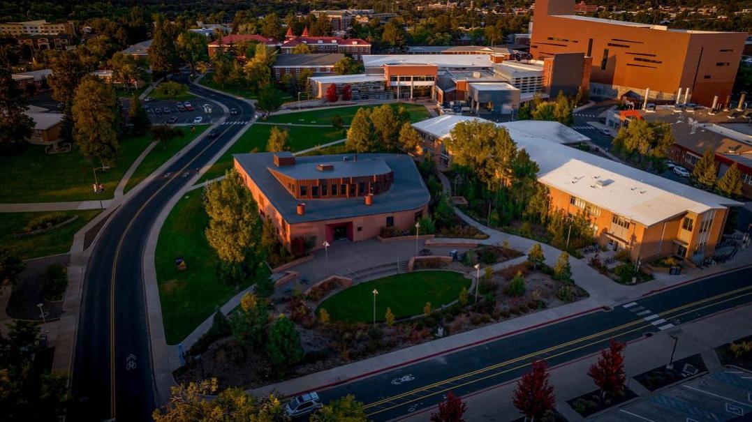 Drone photo of campus with San Francisco Peaks in background. 