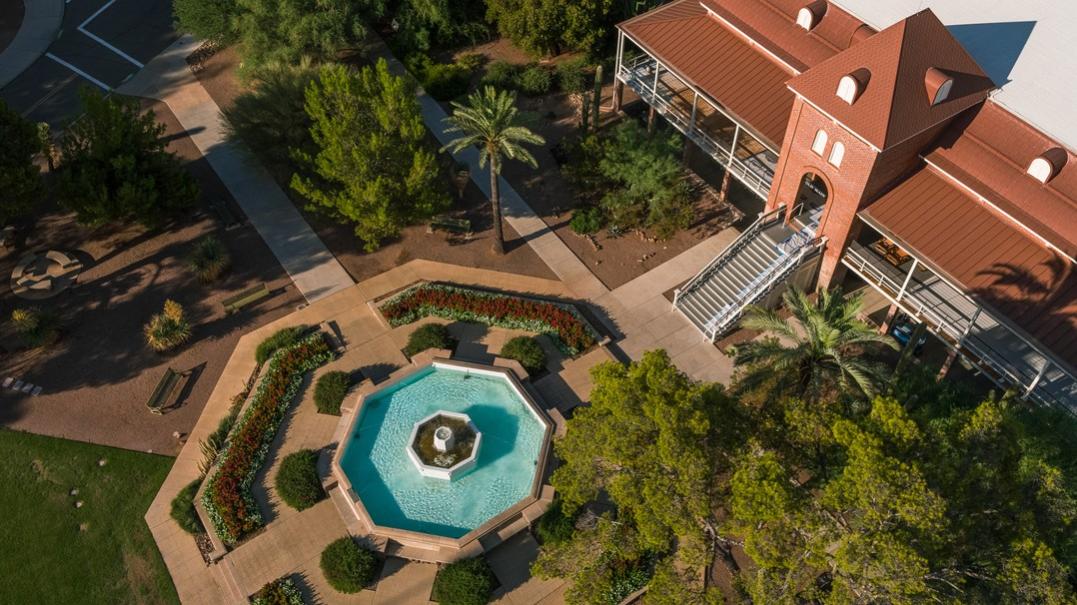 Aerial image of Old Main building with fountain in the image 