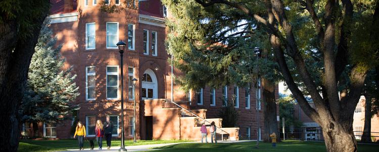 Photo of students walking outside of Old Main on NAU campus. 