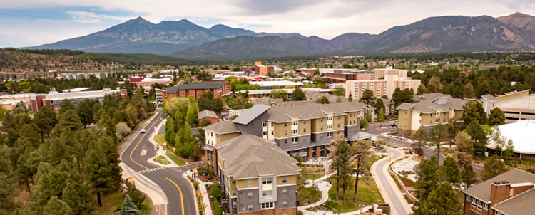 Aerial photo of the NAU campus with mountains in the background 