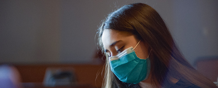 Photo of female student in face mask.