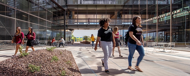 Two female students walking outside of the law building on the ASU Downtown Phoenix campus